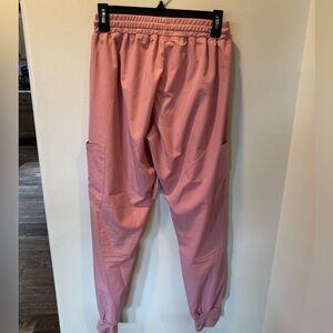 Pink Jogger and Navy Regular scrubs.